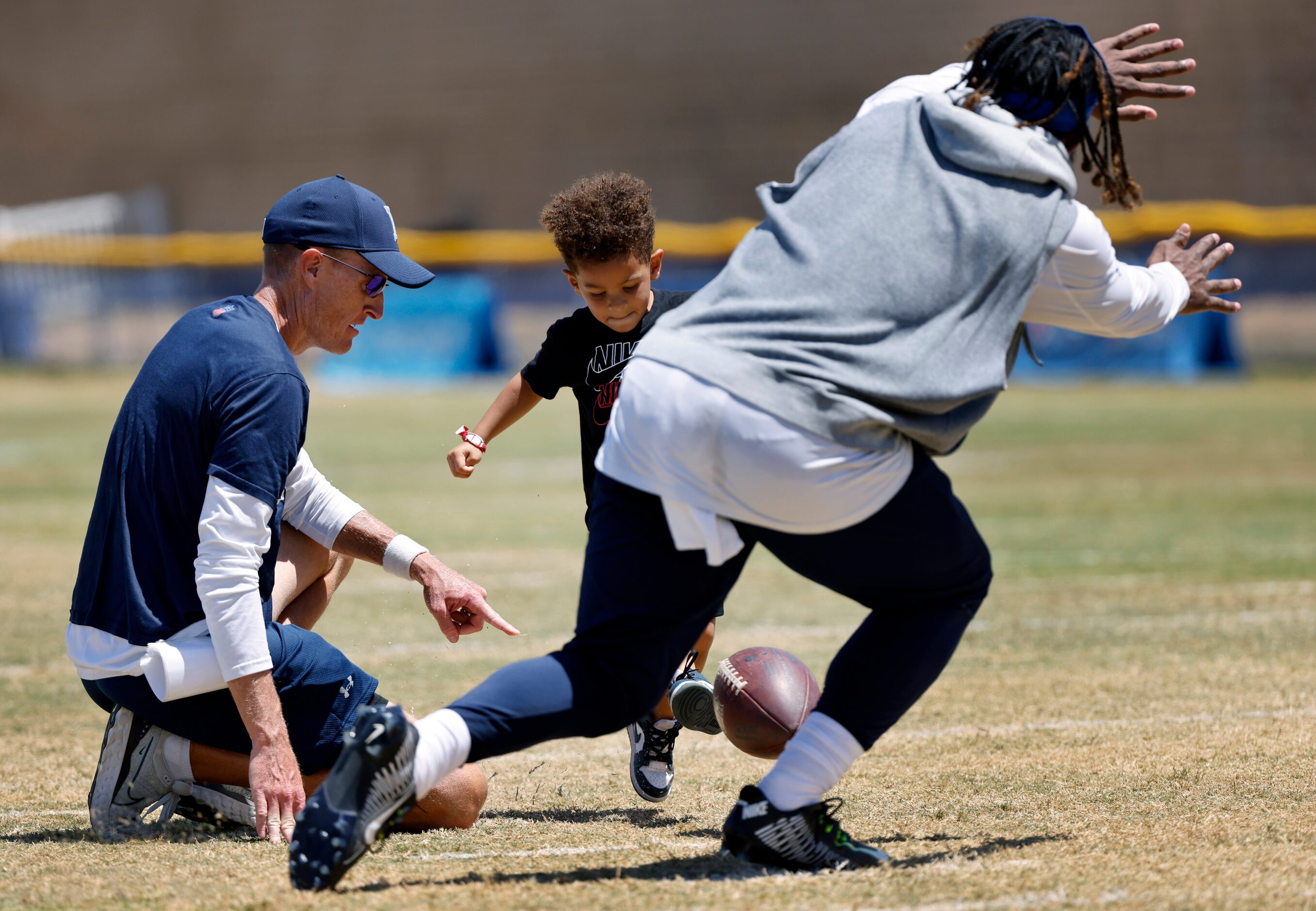 Dallas Cowboys running back Ezekiel Elliott (21) makes a surprising leap in front of Malcom...