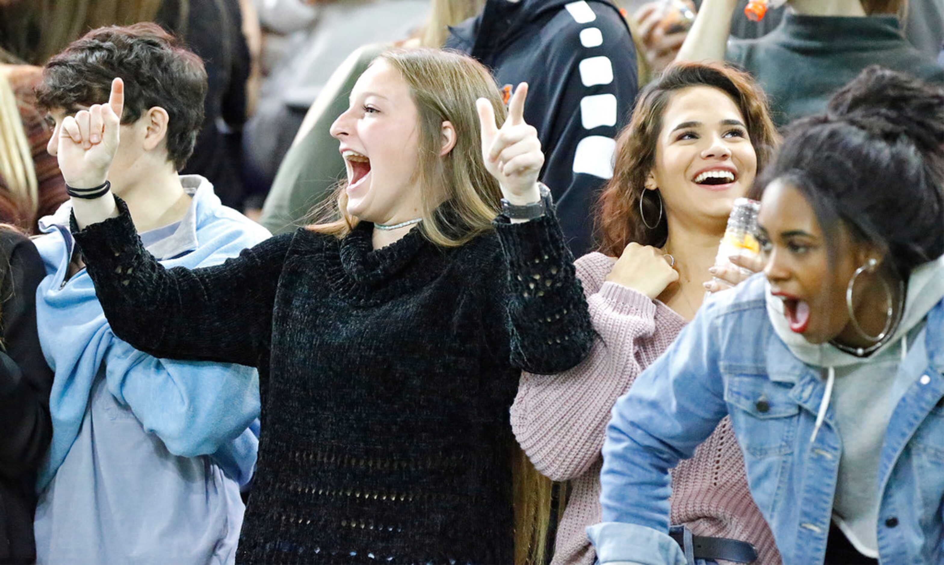 Aledo High School students Makenzie Covington (left), 17, Ellie Reese (center), 17, and...