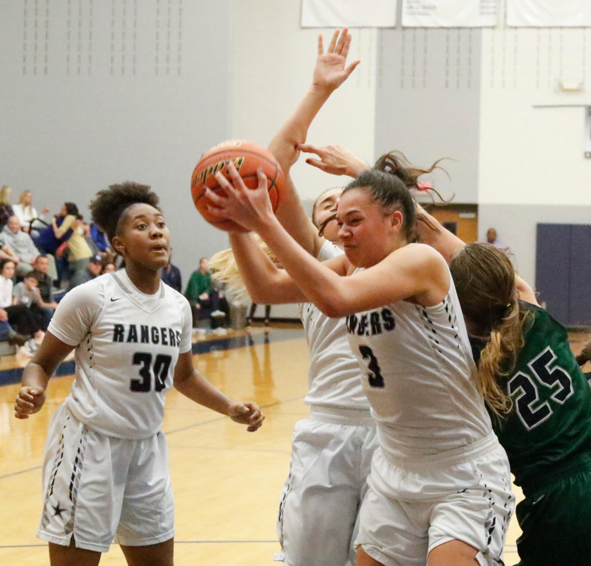 Frisco LoneStar's Kayla Richardson (30) watches teammate Mallory Adams (3) grab a rebound...