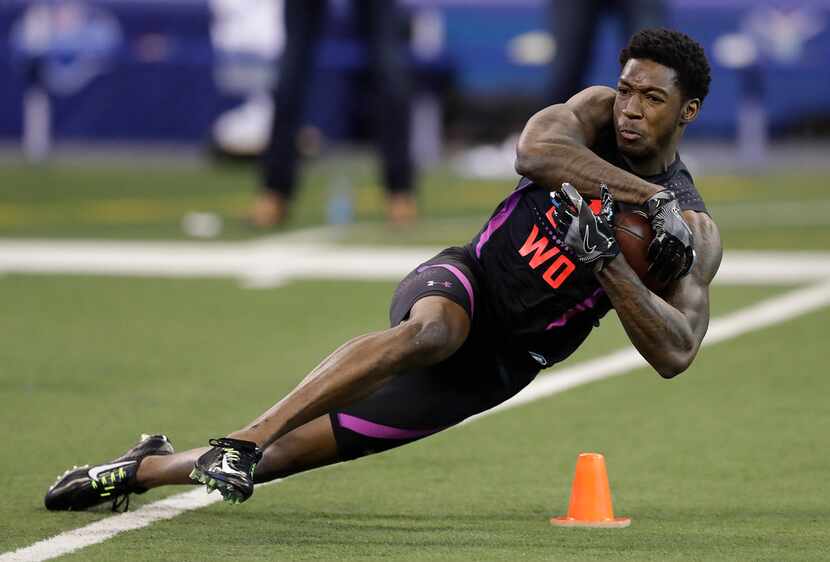 Alabama wide receiver Calvin Ridley runs a drill during the NFL football scouting combine,...