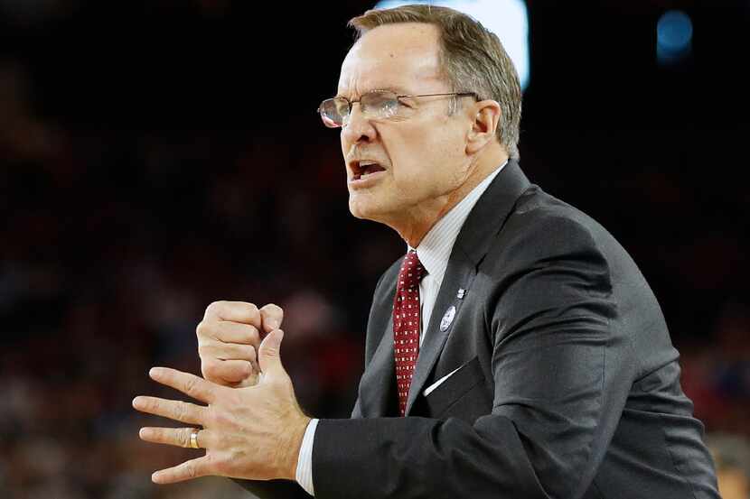 FILE - In this April 2, 2016, file photo, Oklahoma head coach Lon Kruger watches play...