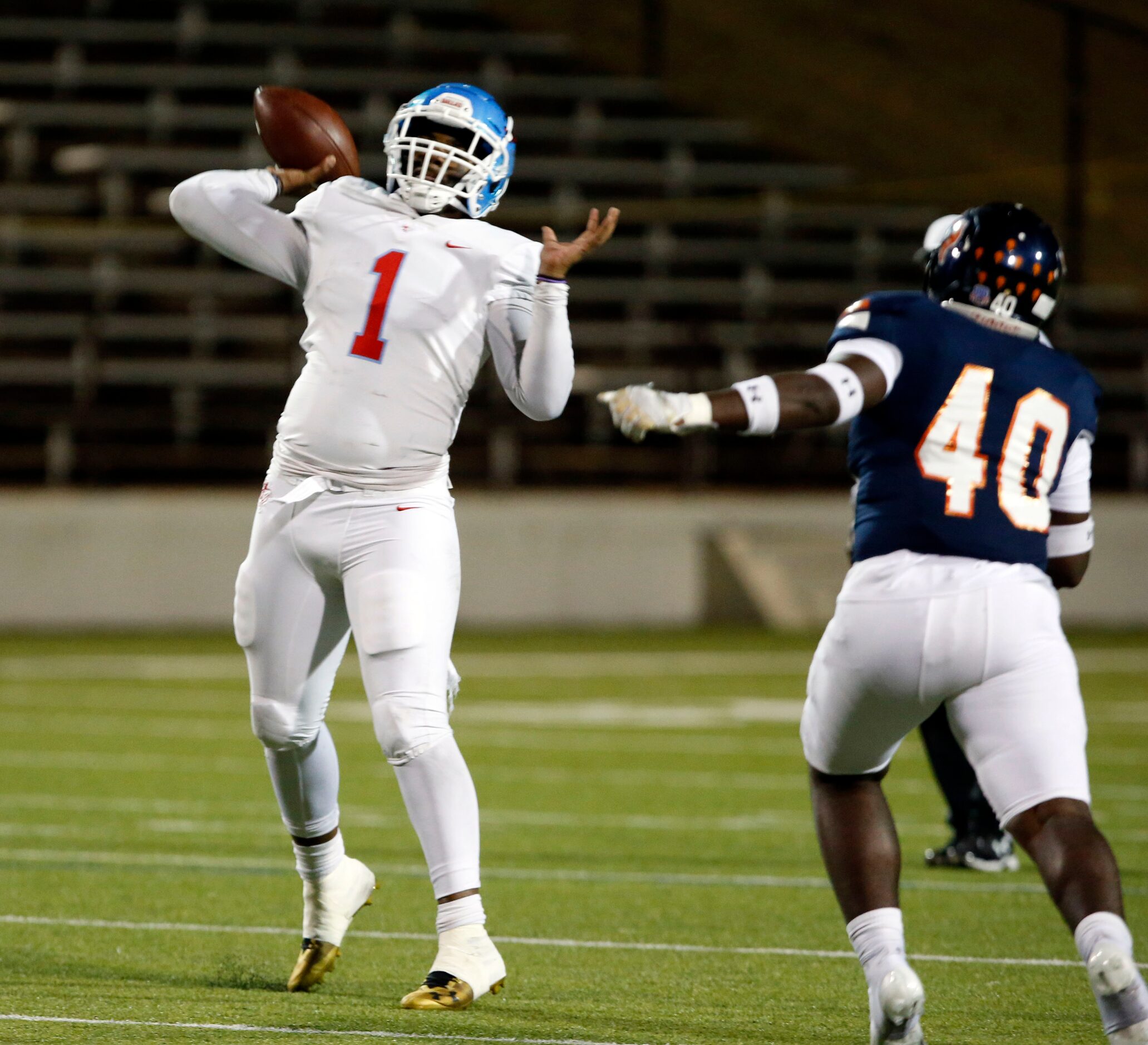 Skyline QB Darryl Richardson (1) throws a touchdown pass during the first half of a high...