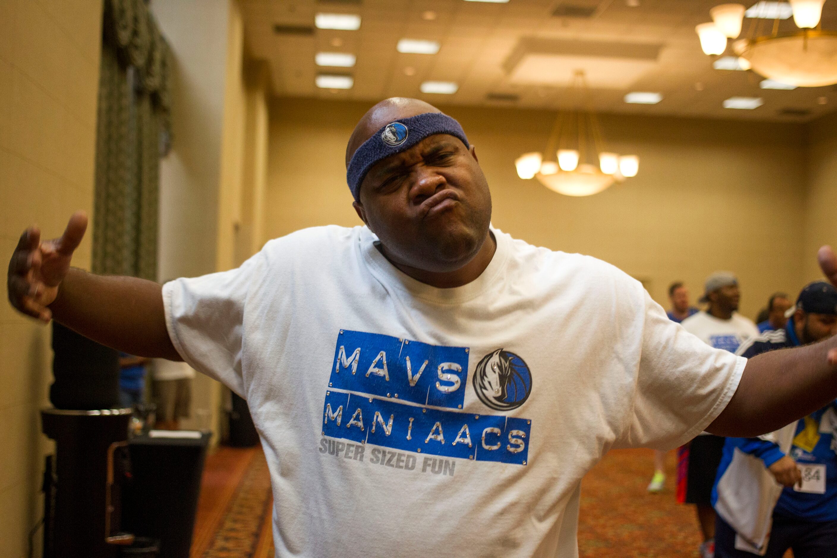 "Red Tiger," team member of The Mavs ManiAACs for eight years, mugs for the camera during...