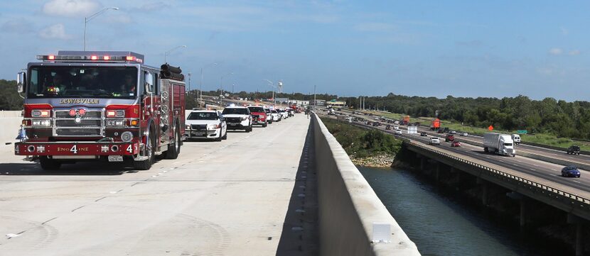 A Lewisville firetruck led the way Wednesday after a ceremony commemorating the opening of...