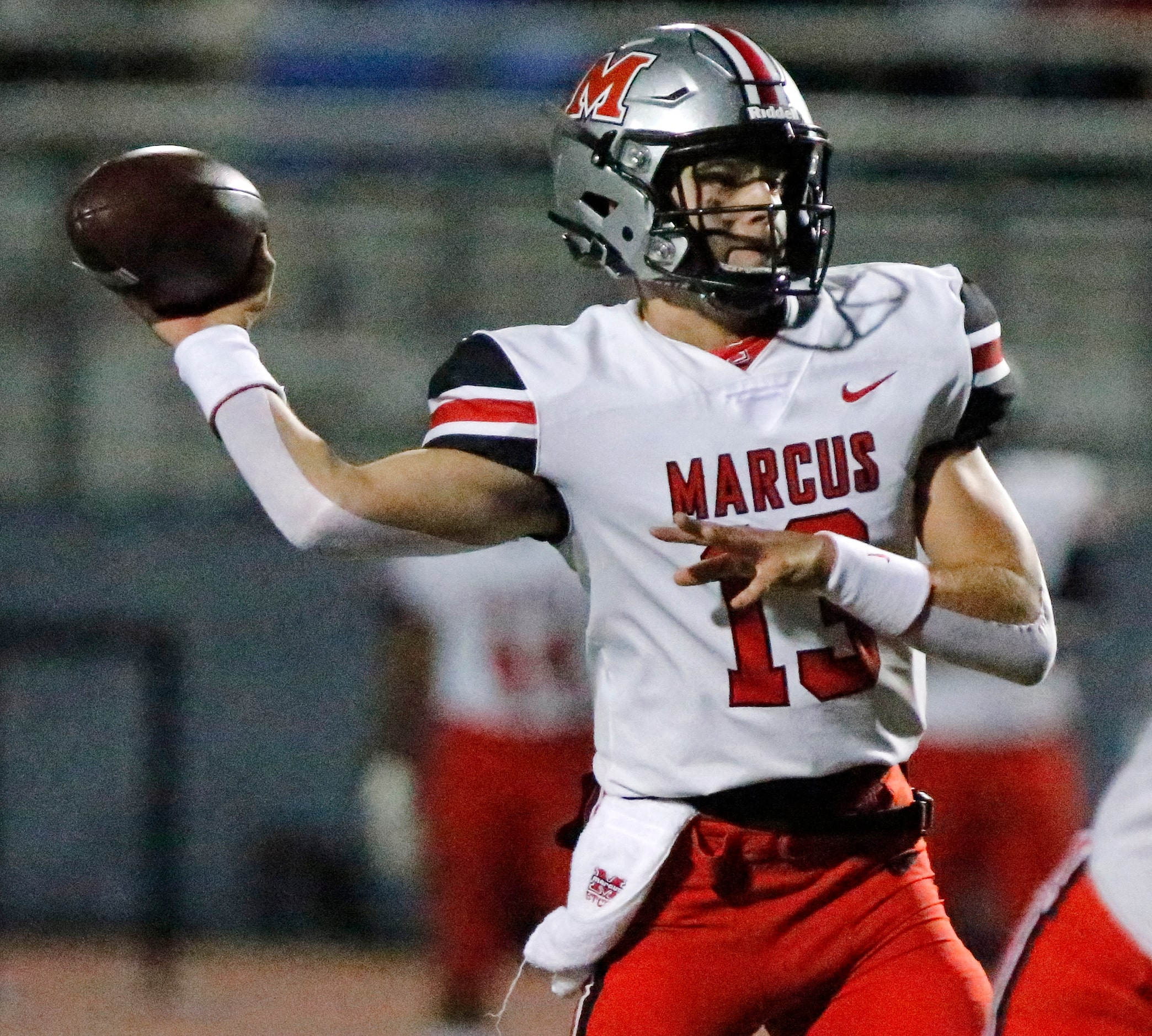 Flower Mound Marcus quarterback Garrett Nussmeier (13) throws a pass during the first half...