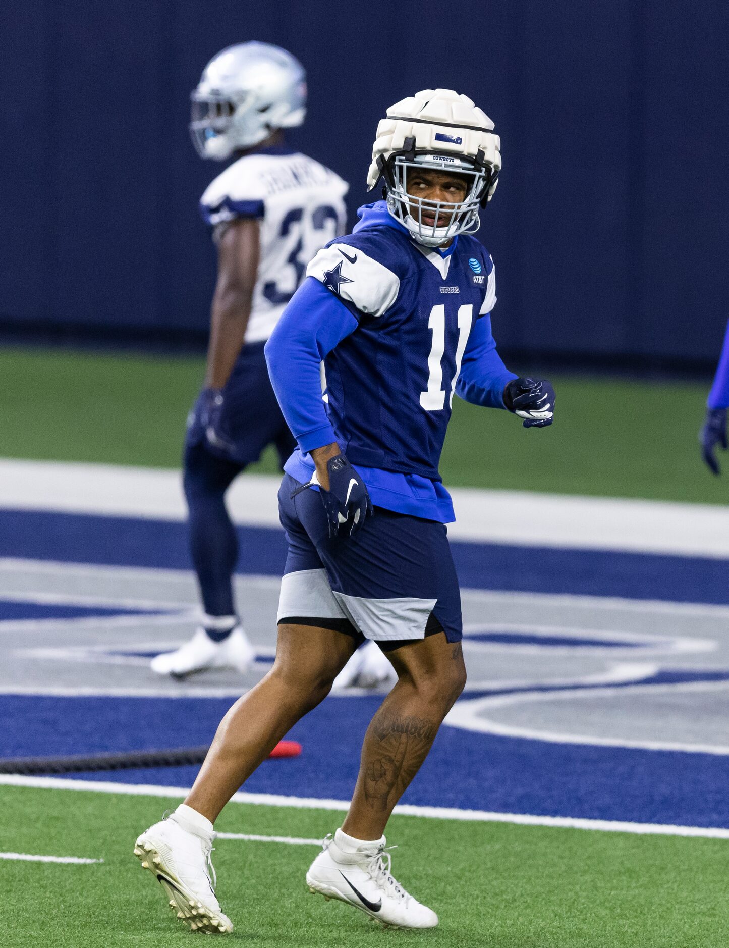 Dallas Cowboys linebacker Micah Parsons is seen wearing a padded cover on top of his normal...