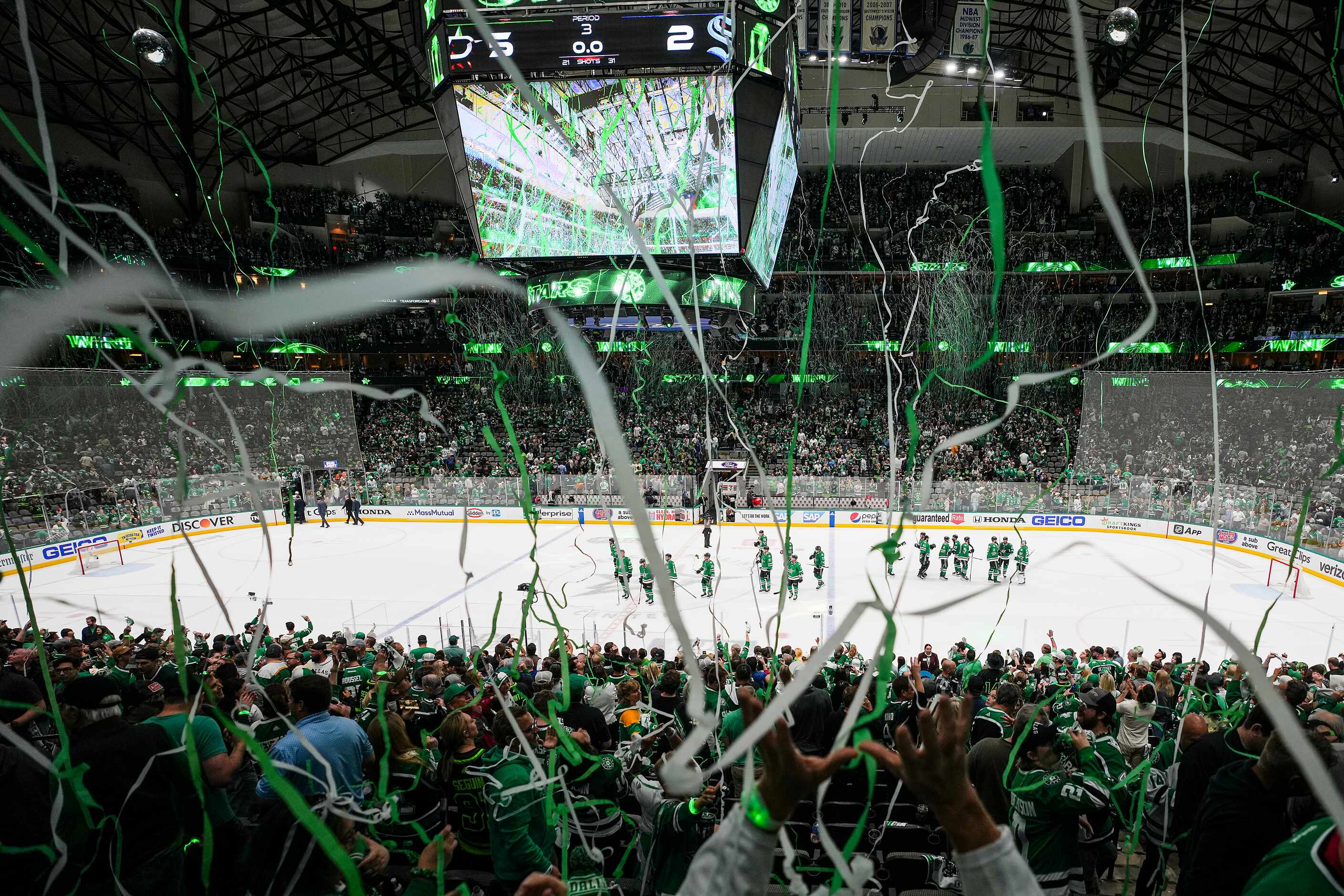 Streamers fall from the rafters as the Dallas Stars celebrate after a victory over the...