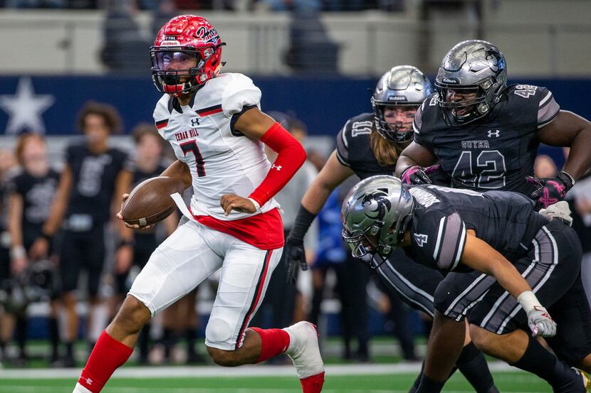 Cedar Hill quarterback Kaidon Salter (7) maneuvers past Denton Guyer defense during the...