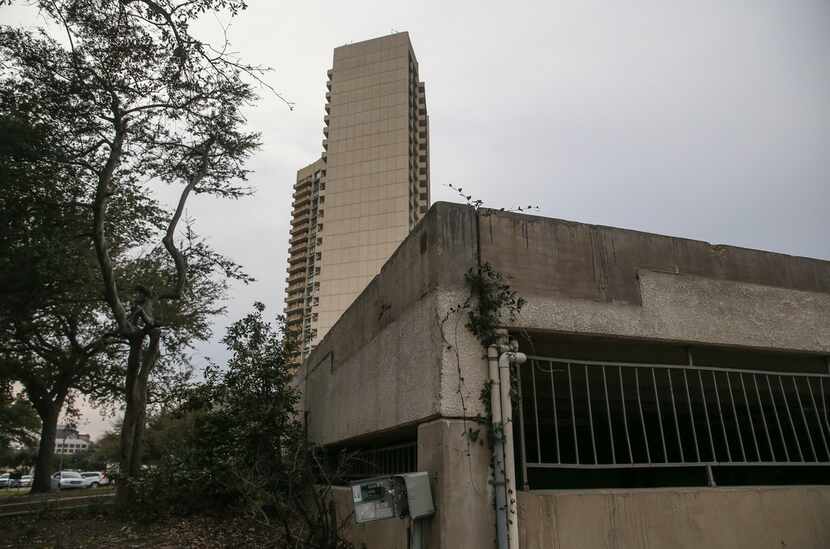 In the shadow of Preston Tower, this burned-out husk of a concrete parking garage is all...