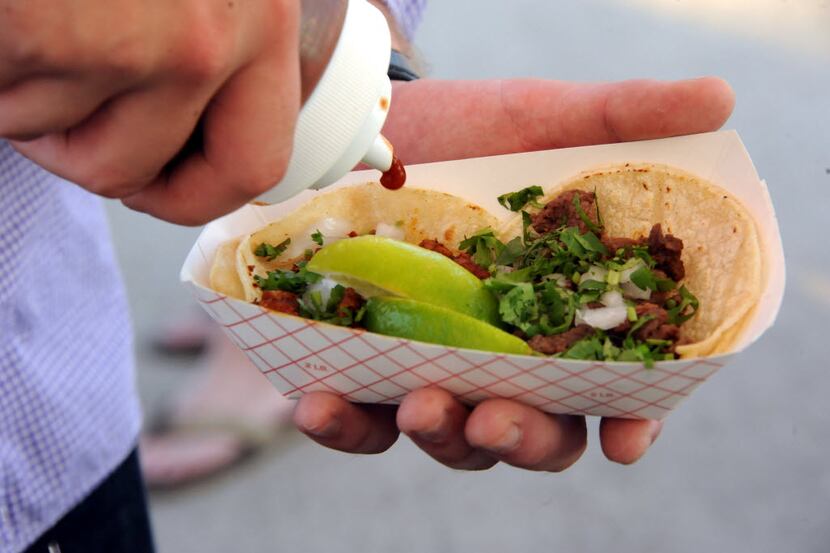 Beef tacos from El Come Taco are served for guests at Lone Star Beer Texas Heritage Festival...
