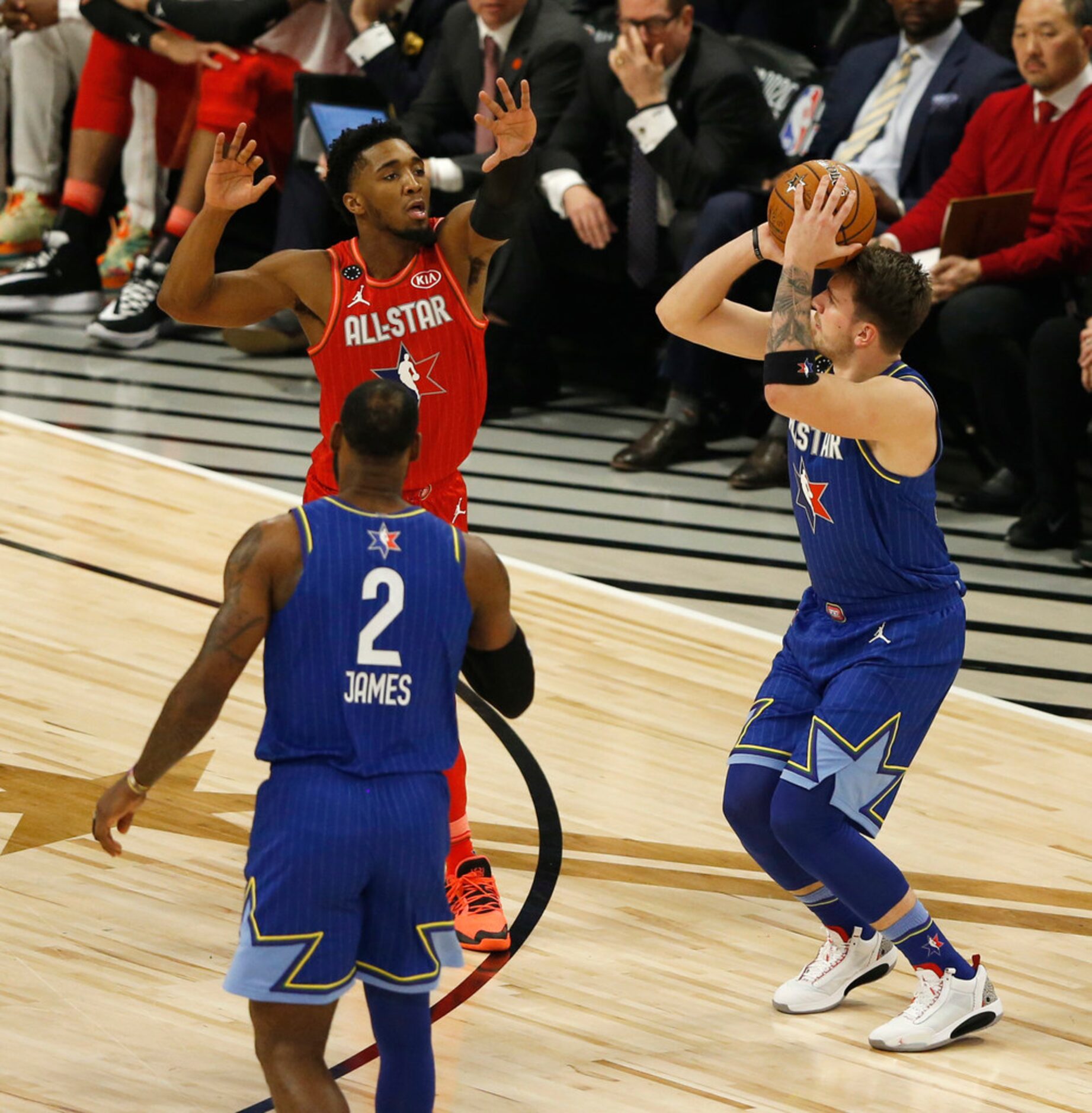 Team LeBron's Luka Doncic (2) shoots and makes a three pointer in front of Team Giannis'...