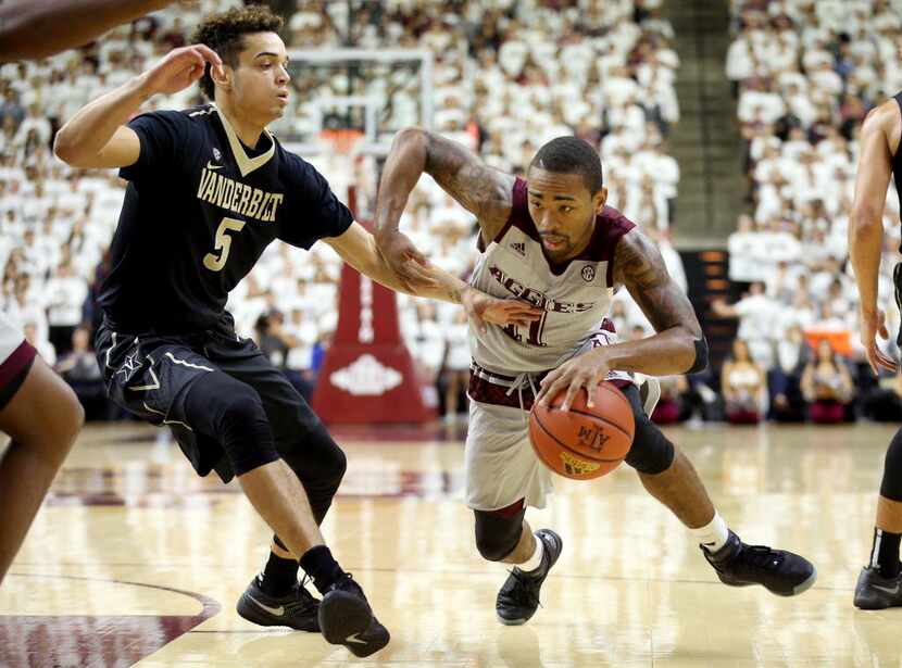 Texas A&M's Anthony Collins (11) drives the lane against Vanderbilt's Matthew Fisher-Davis...