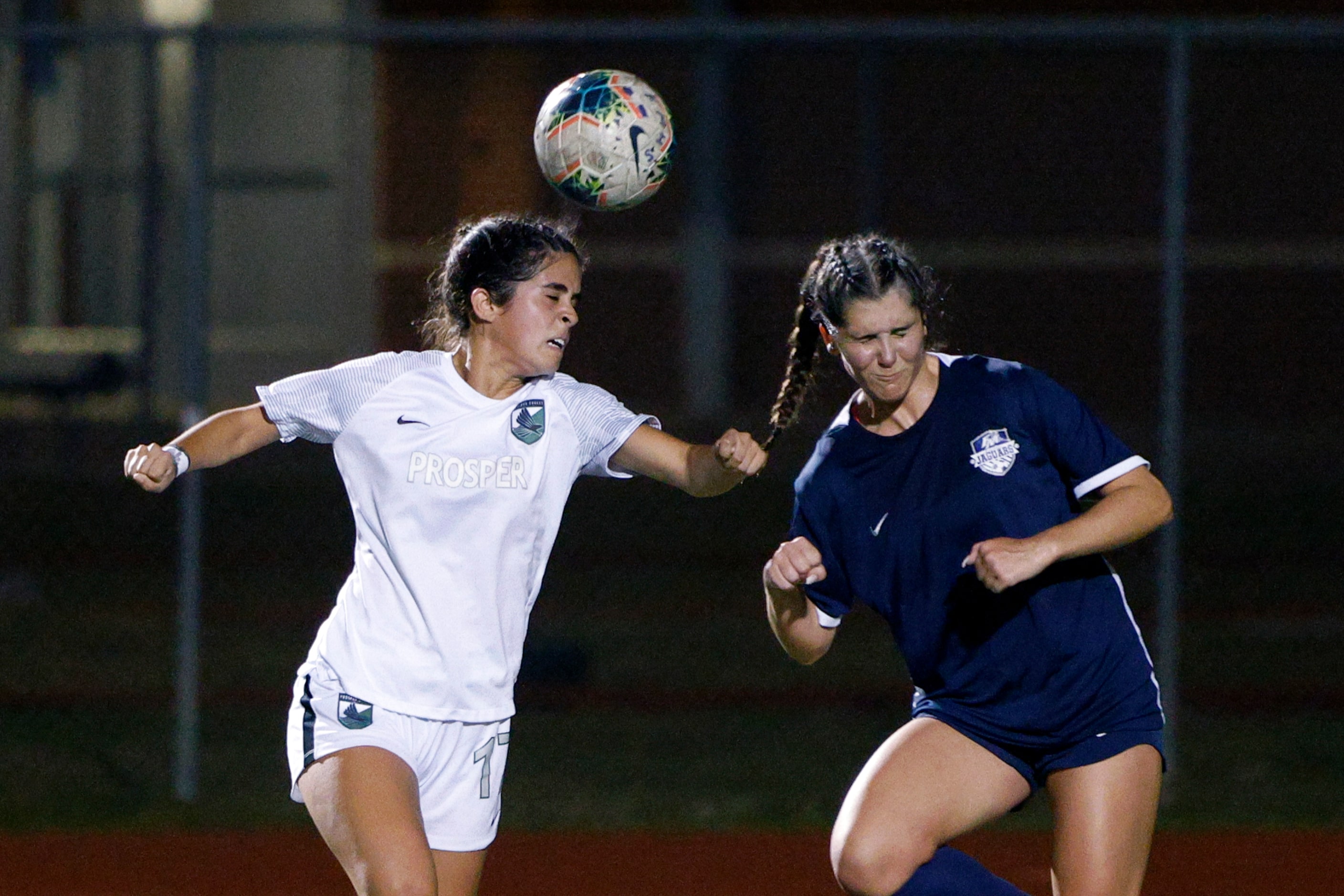 Prosper forward Isabella Fregoso (left) heads the ball towards goal ahead of Flower Mound...