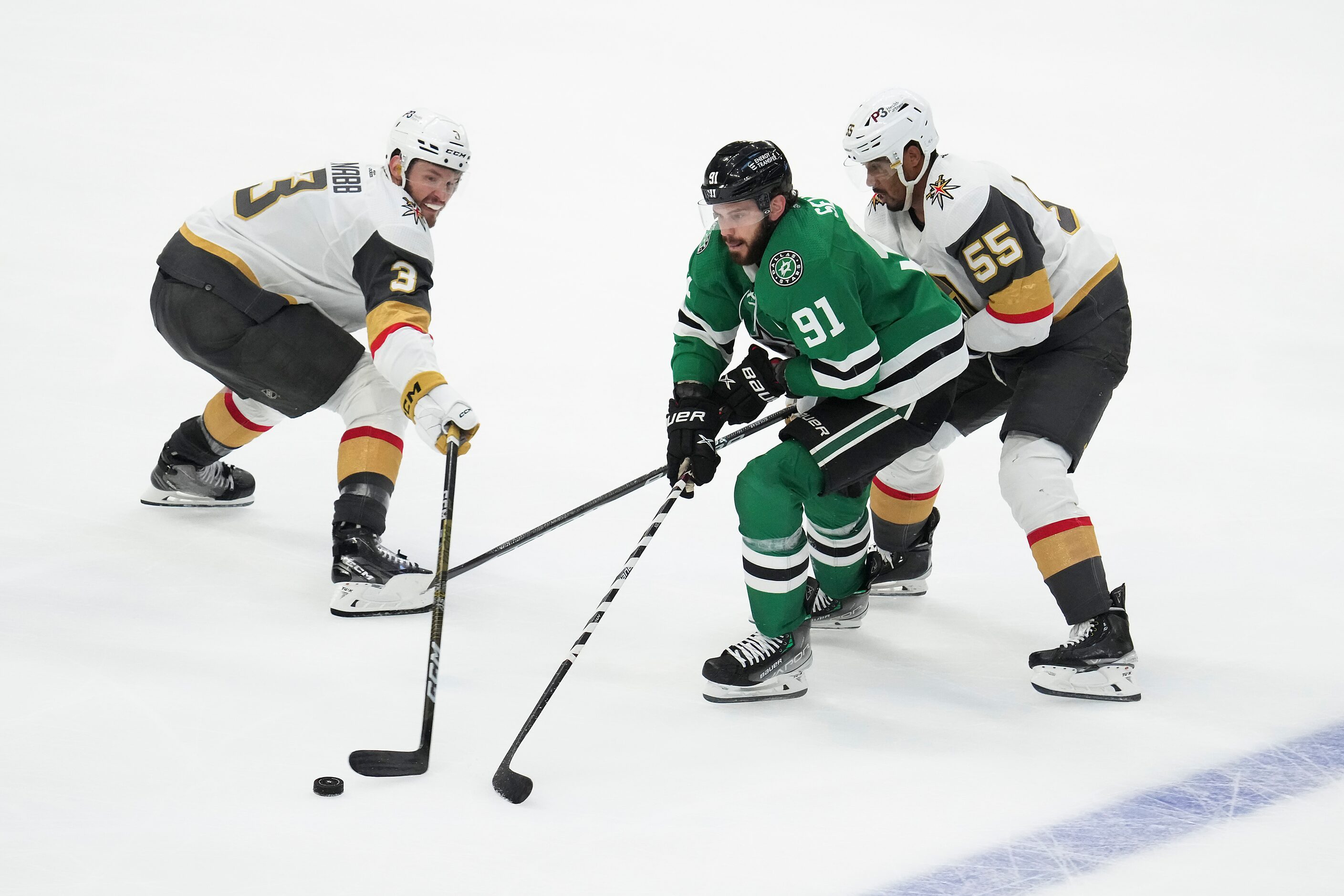 Dallas Stars center Tyler Seguin (91) loses the puck as he is defended by Vegas Golden...