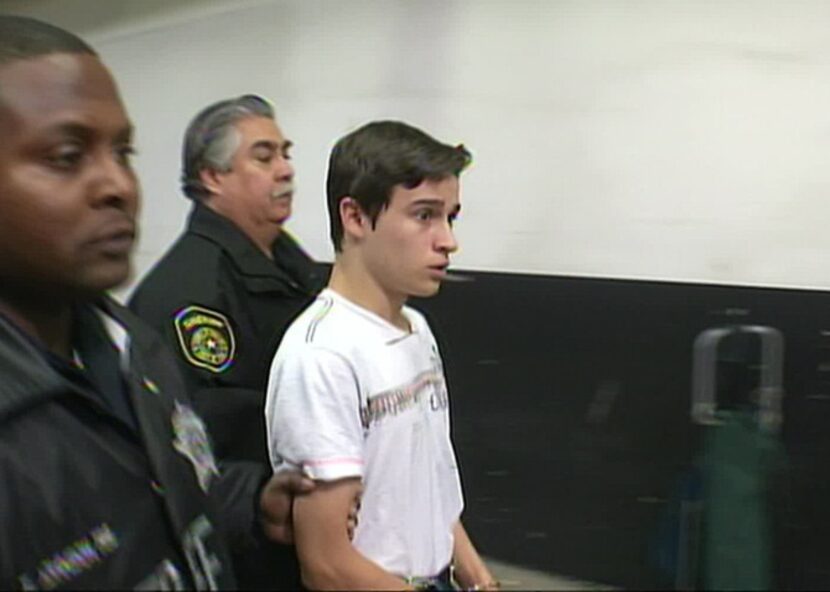 Sheriff’s deputies escorted Colten Jon Moore at the Lew Sterrett Justice Center on Thursday....