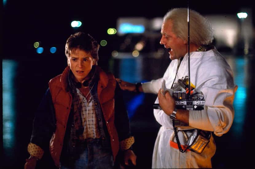 Michael J. Fox, left, stars as Marty McFly, and Christopher Lloyd as Dr. Emmett Brown in...