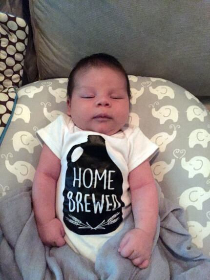 For Beer Week story. Three and a half week old Bash, son of Dallas CPA Guy Mitchell, wears a...