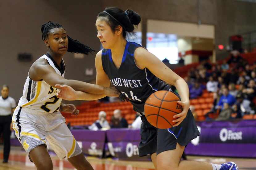 Plano West Natalie Chou (24) dribbles past Amarillo's Sidney Tinner (22) in the second half...