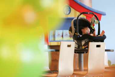 Victoria Gwynn, 1, napped near the balloon arch set up for her first birthday party hosted...