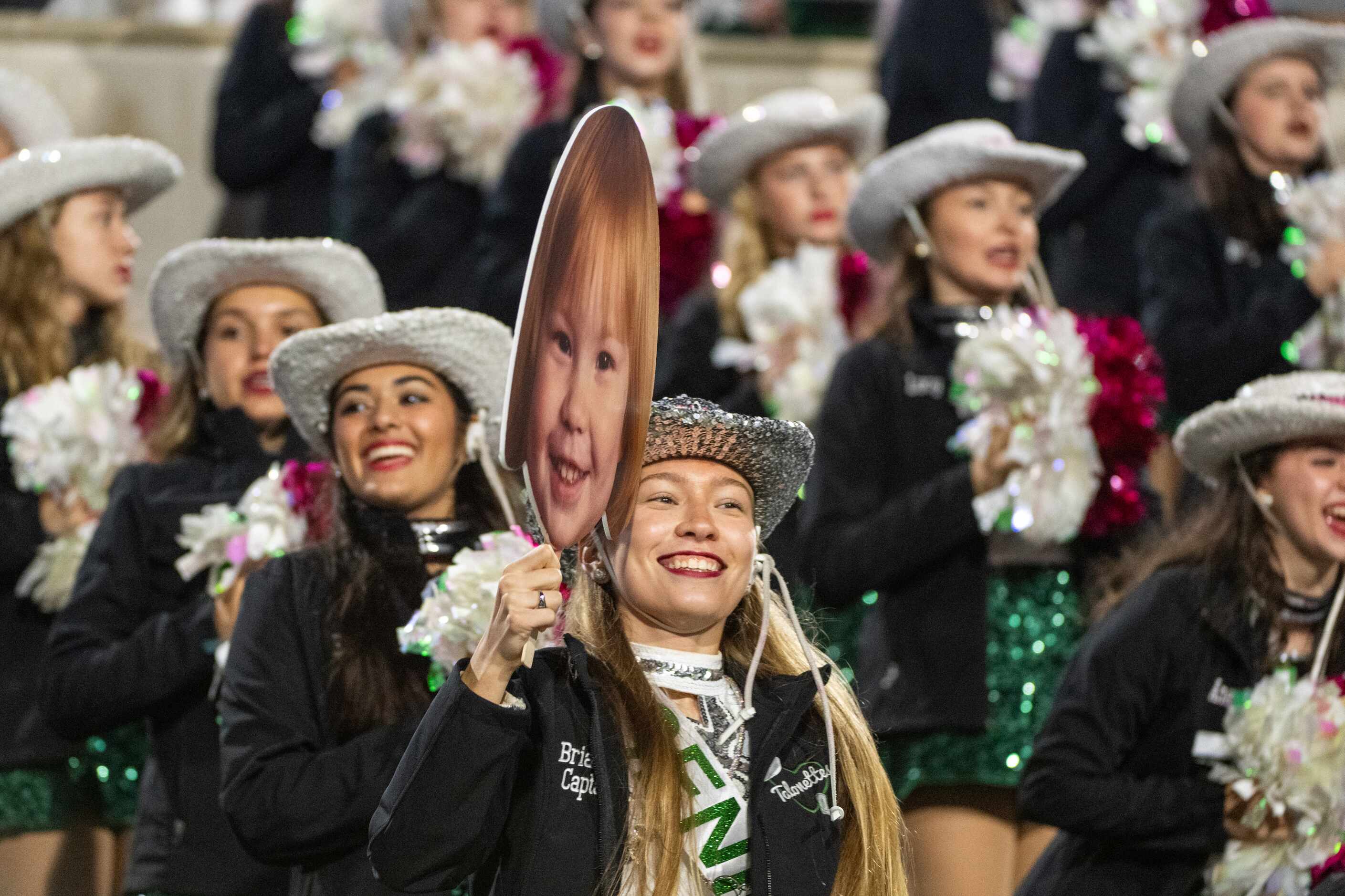 Prosper senior Brianna Marler cheers in the stands with a childhood photos in the second...