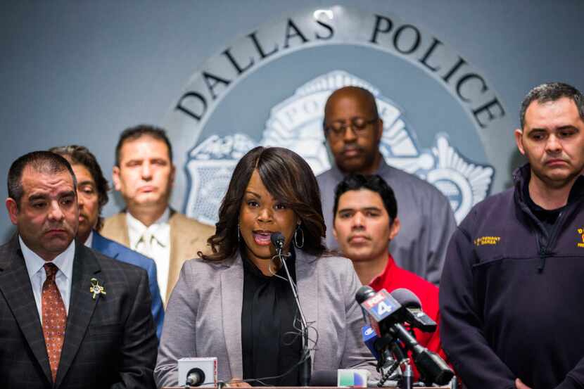 Dallas police and firefighters, shown here at a January news conference in Dallas, face deep...