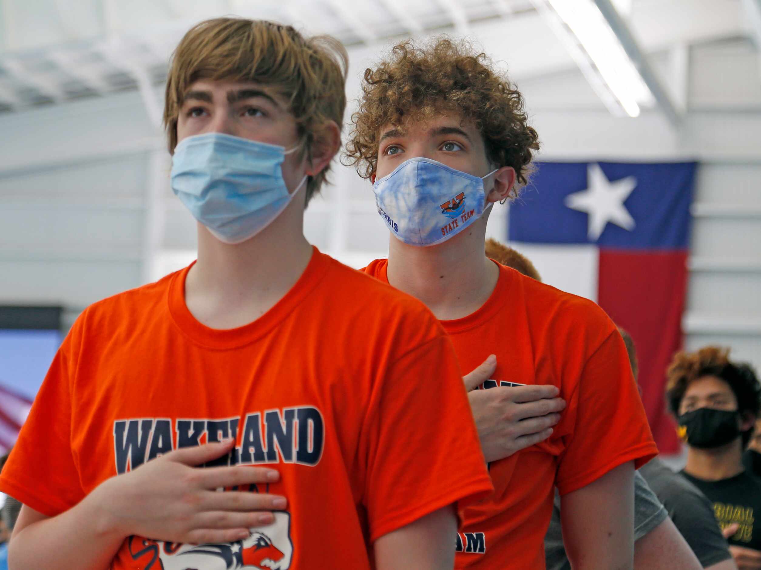 Wakeland swimmers stand for the opening ceremony. UIL boys 5A swim finals on Saturday,...