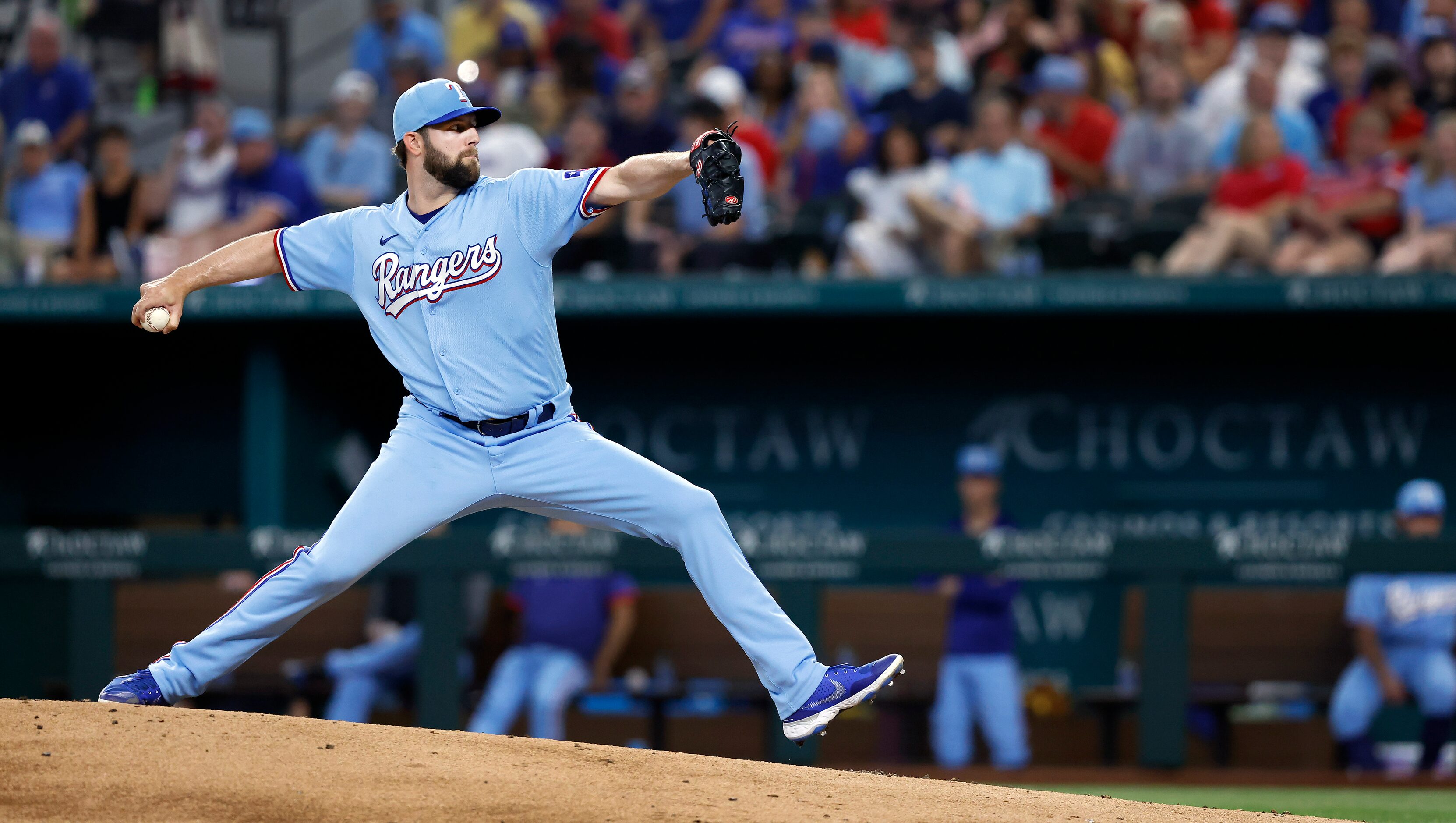 Texas Rangers starting pitcher Jordan Lyles (24) throws against the Kansas City Royals in...