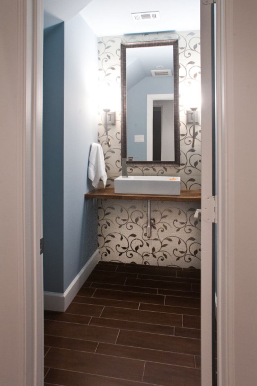 The homeowners requested Gilliam build a wood vanity with sinks like those pictured in this...