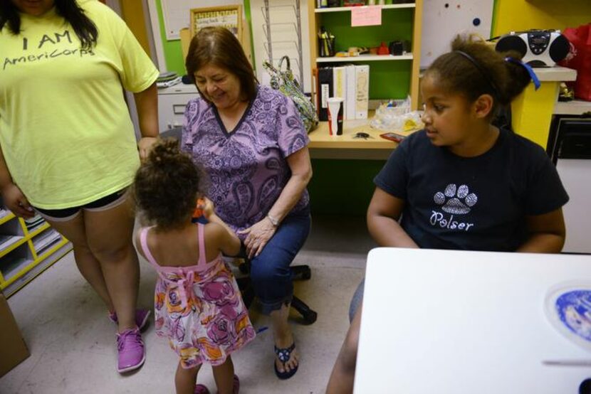 
Beatriz “Bea” Salazar, founder of Bea’s Kids, talks to her granddaughter, Addison.
