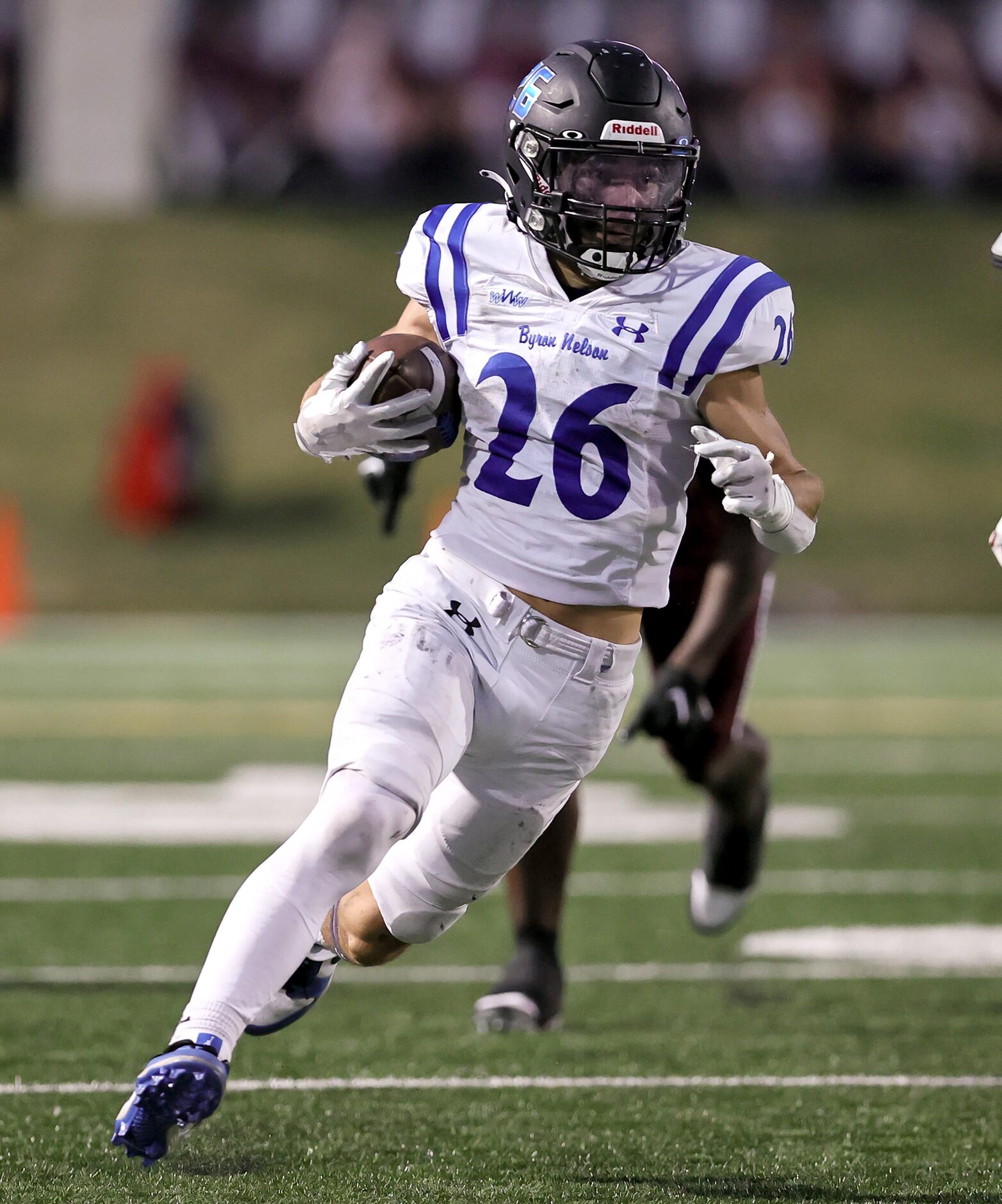 Byron Nelson running back Tucker James looks for running room against Plano during the first...