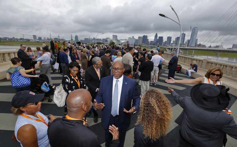 Ambassador Ron Kirk is greeted  before the dedication ceremony for the Ronald Kirk...