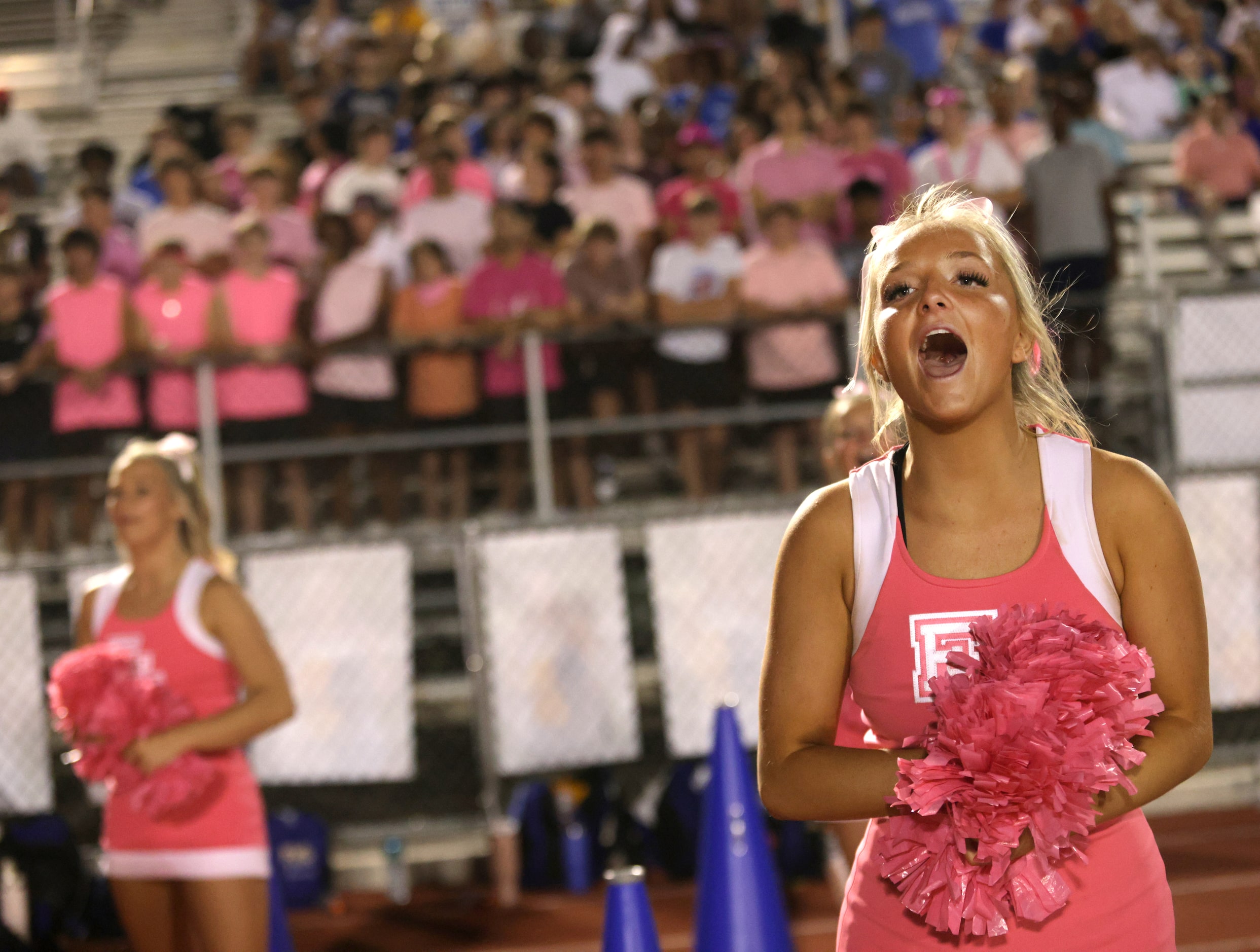 Frisco High School cheerleaders and fans get excited after a first down during the Frisco...