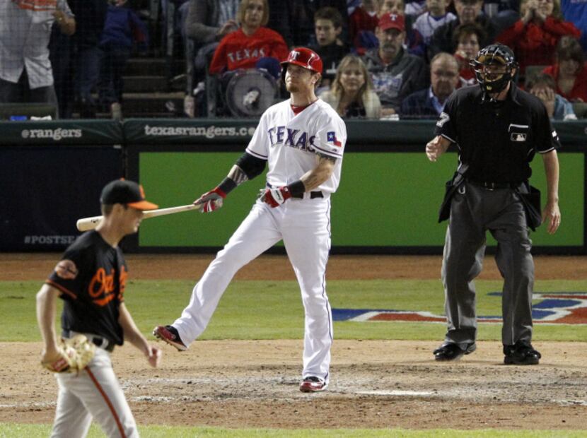 Texas Rangers left fielder Josh Hamilton (32) reacts after striking out on a pitch from...
