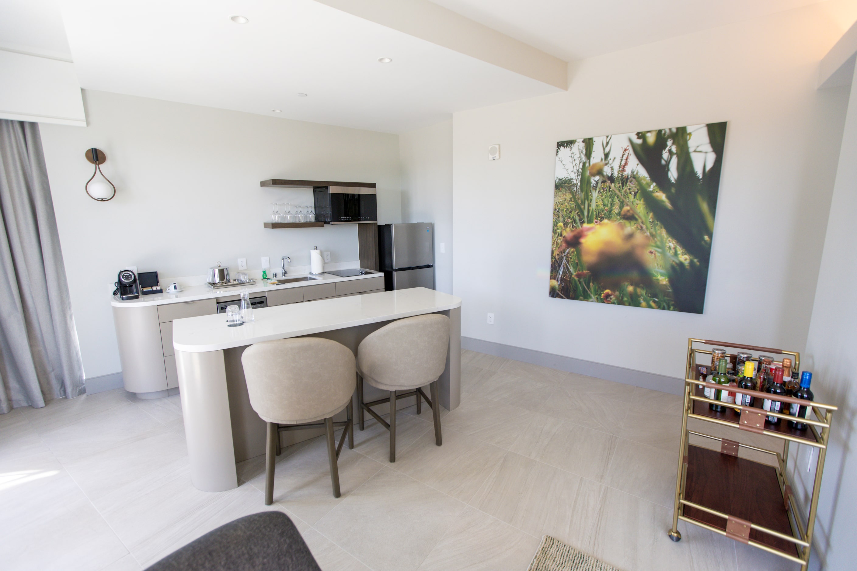 The kitchenette of one of three presidential suites at the Hall Park Hotel in Frisco,...