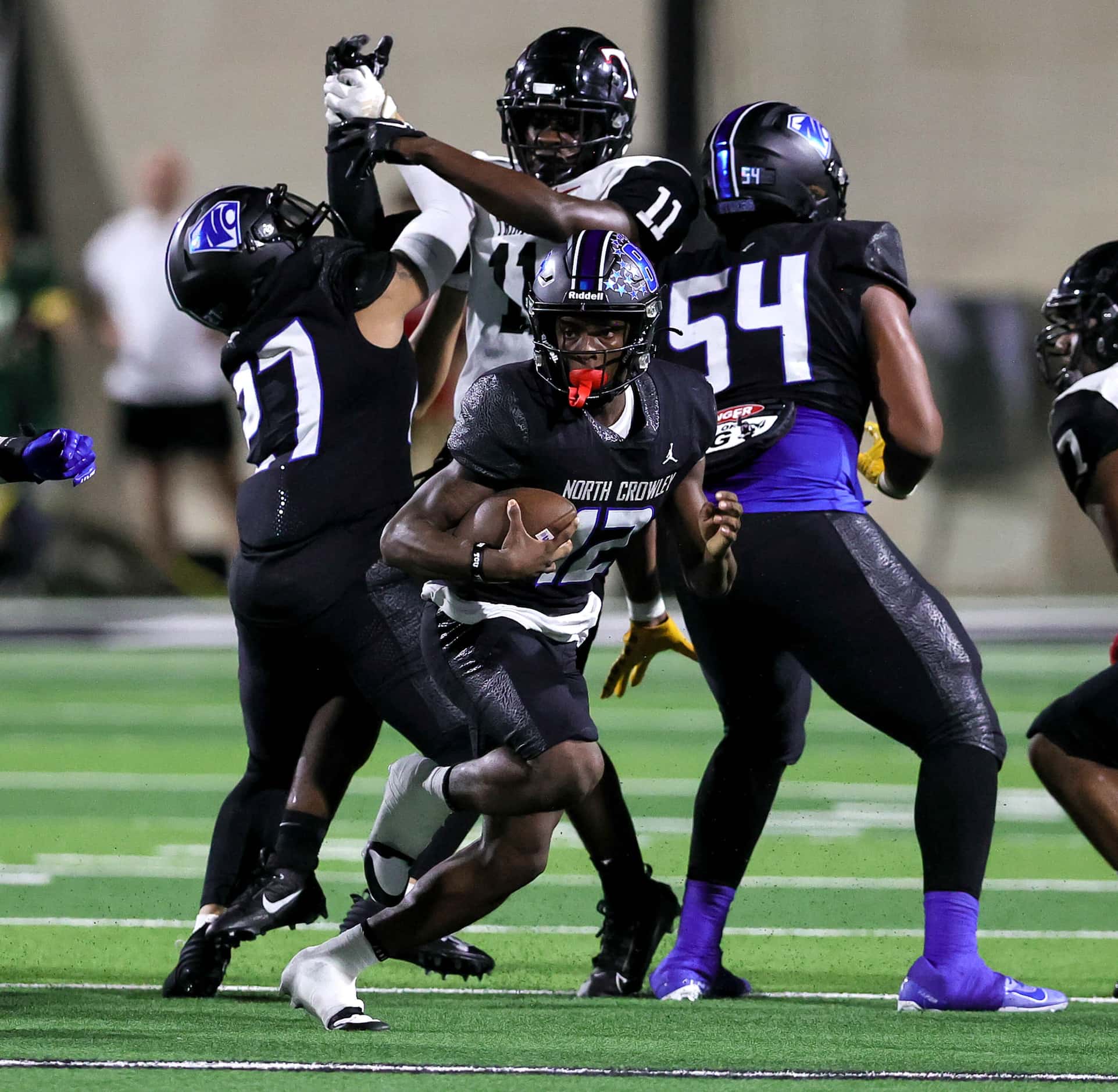 North Crowley quarterback Chris Jimerson Jr. (12) looks for running room against Euless...