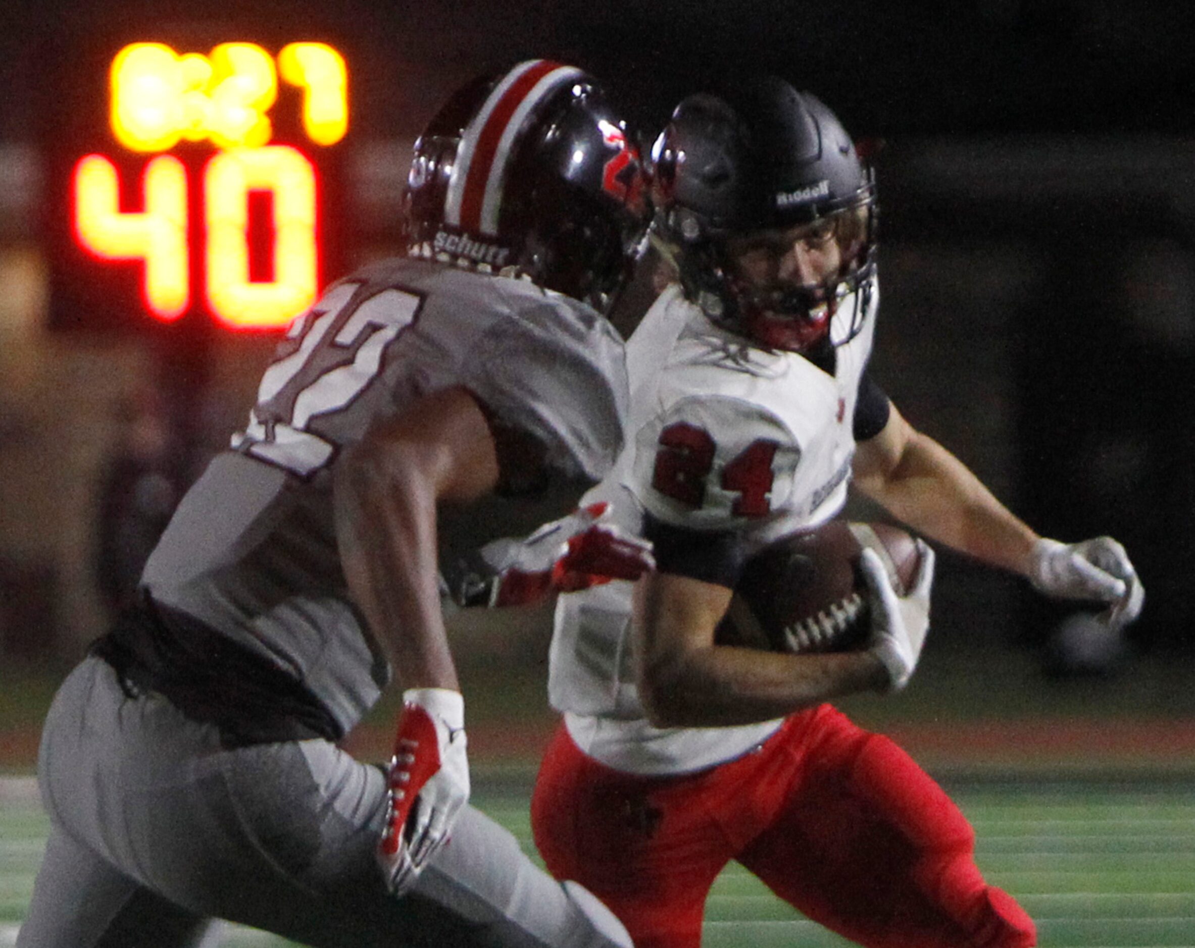 Frisco Liberty receiver Jack Bryan (24) eyes the defense of Lucas Lovejoy defensive back...