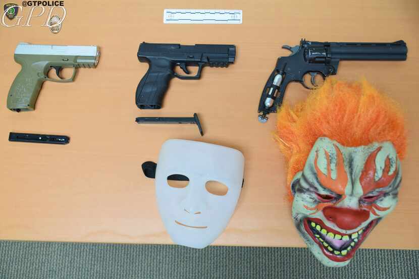 A photo of evidence, including BB guns and masks, obtained by authorities in connection with...