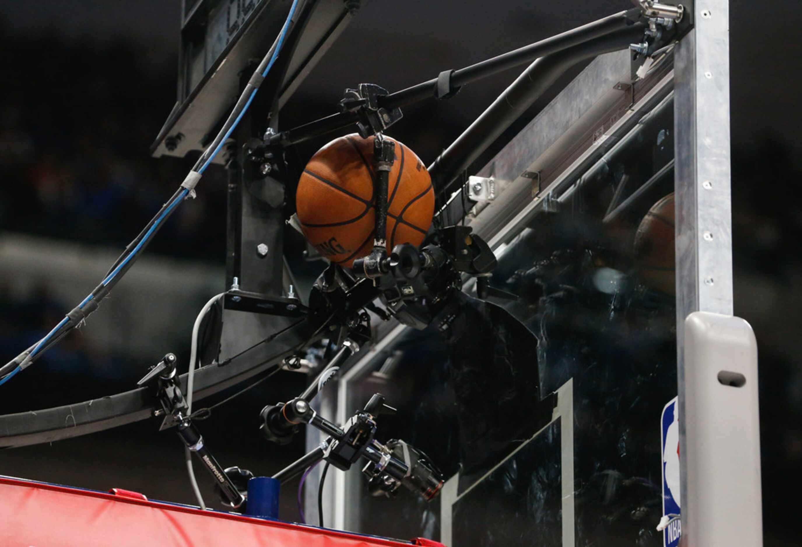 The ball is lodged between backboard cameras during the second half of an NBA matchup...