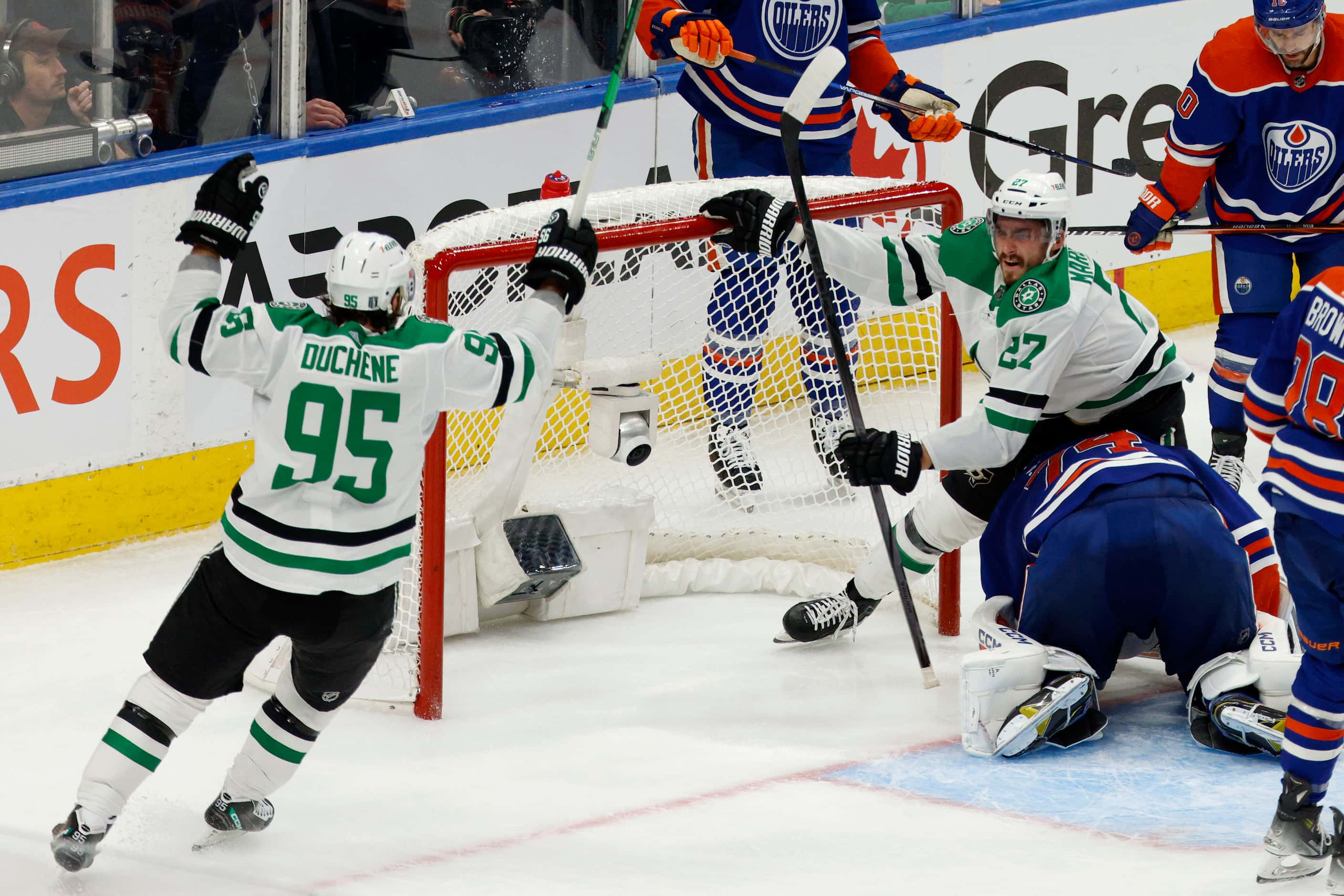 Dallas Stars left wing Mason Marchment (27) pushes the goal back after scoring a goal as...