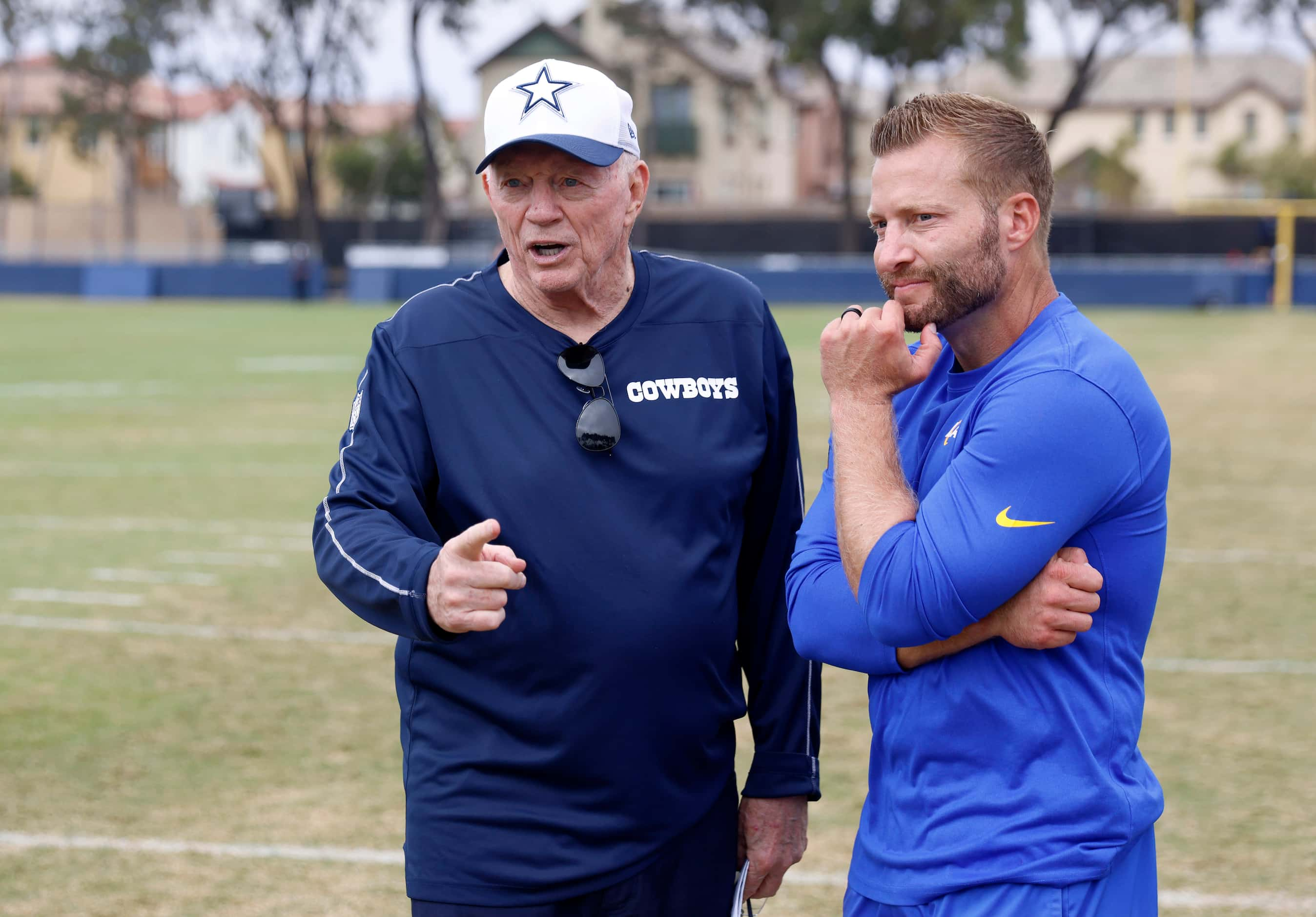 Dallas Cowboys owner Jerry Jones visits with Los Angeles Rams head coach Sean McVay...