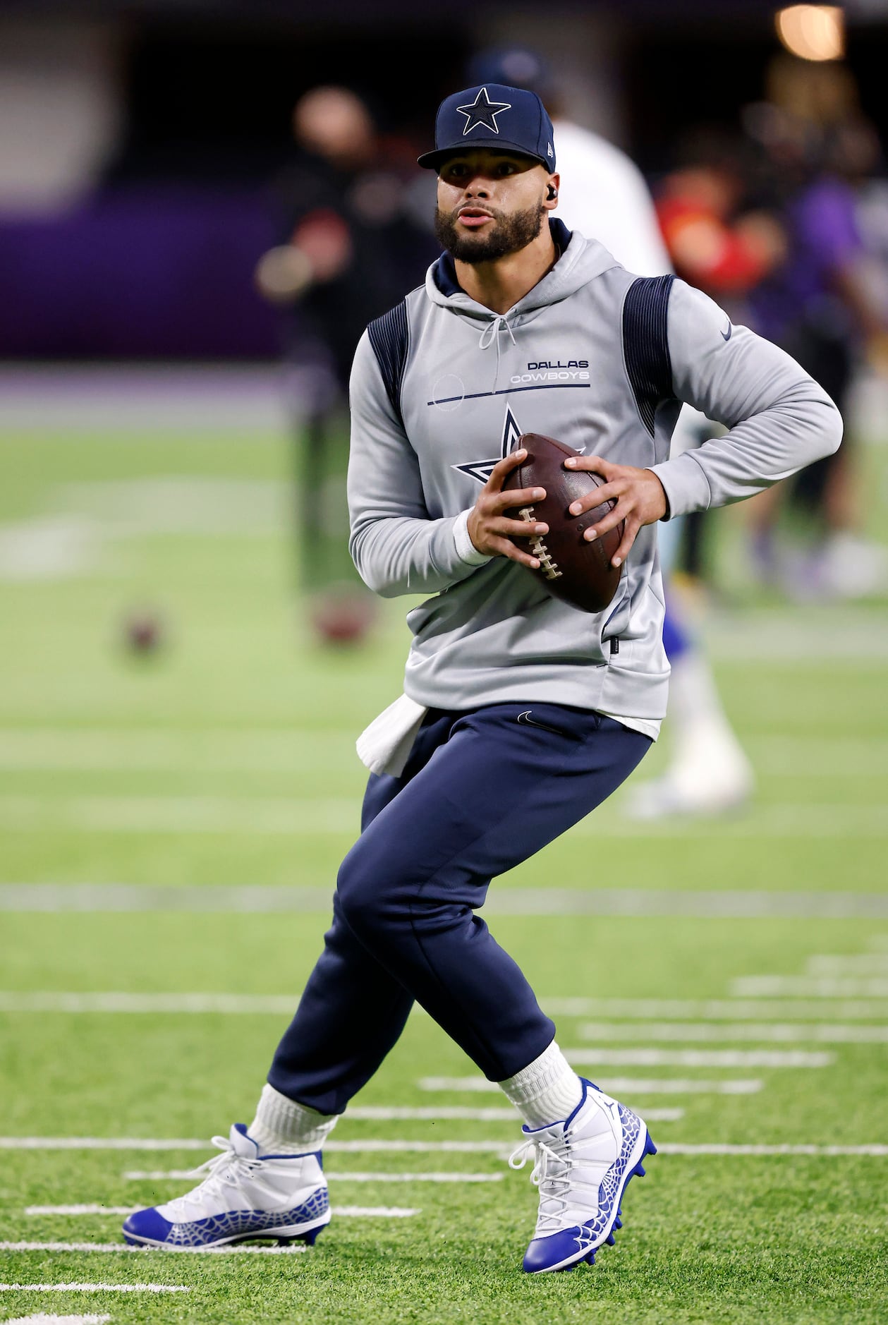 Dallas Cowboys quarterback Cooper Rush warms up before the game