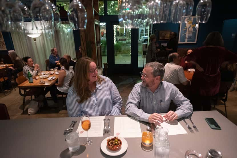 Patrons Carole Walter and Dale Walter sat at the bar as they waited for their reservation...