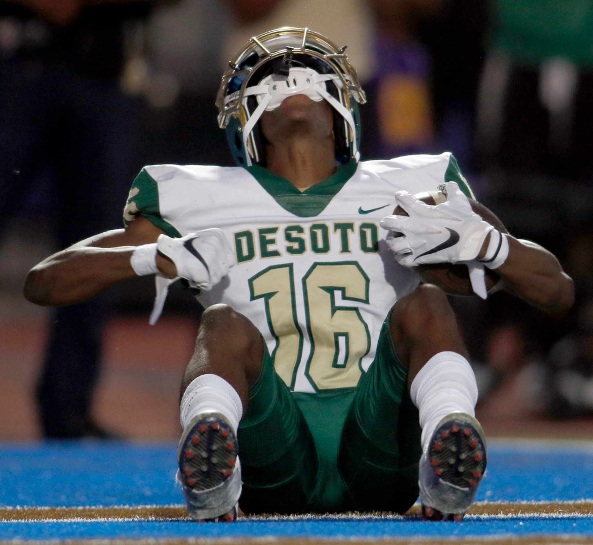 DeSoto Eagles receiver Ashtyn Hawkins (16) does his eagle imitation in the end zone after...