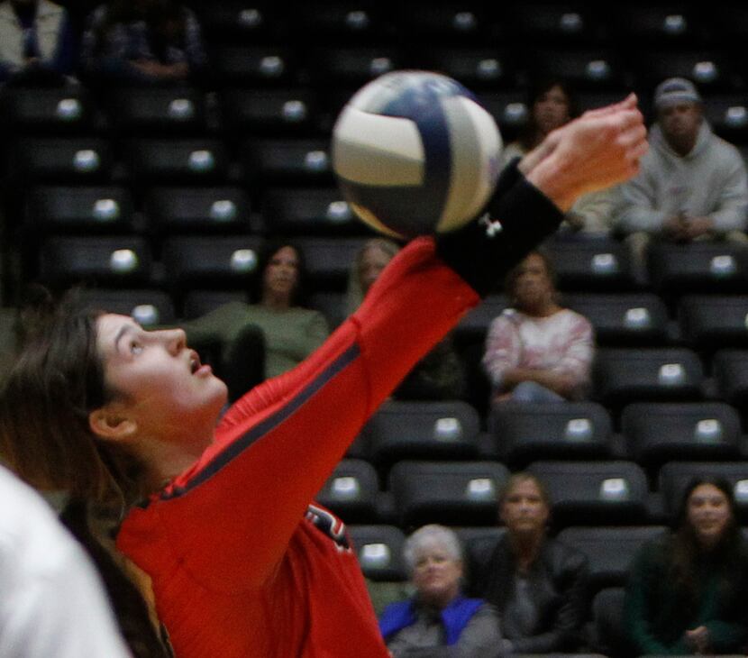Grapevine senior Janet deMarrais (12) makes an over the head return during the 3rd set of...