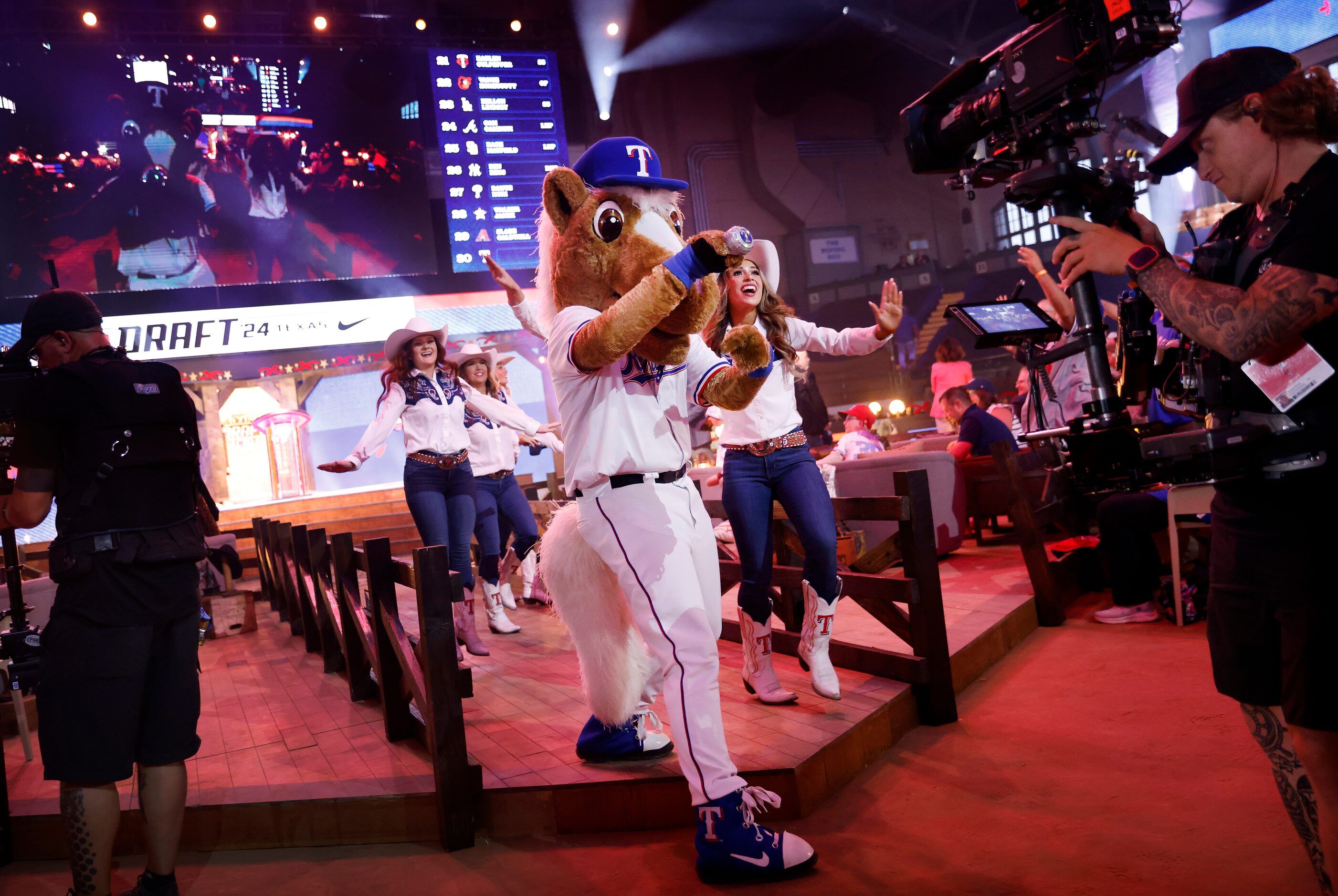 Rangers Captain, the team mascot, and the Six Shooters dance team performs before the team...