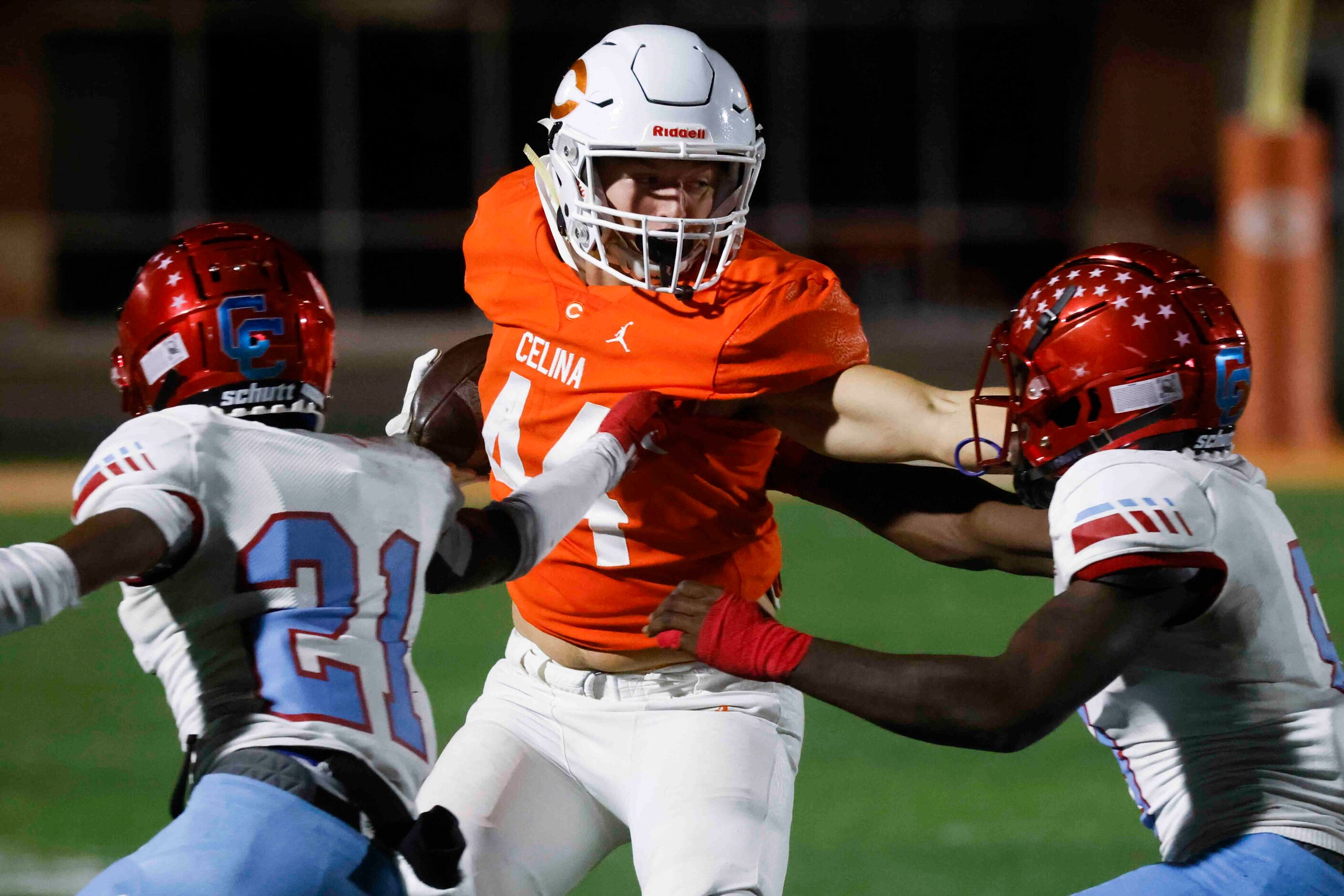 David W. Carter High School’s Brandon Bennett (21), left, and Khyion Andrews (9), right,...