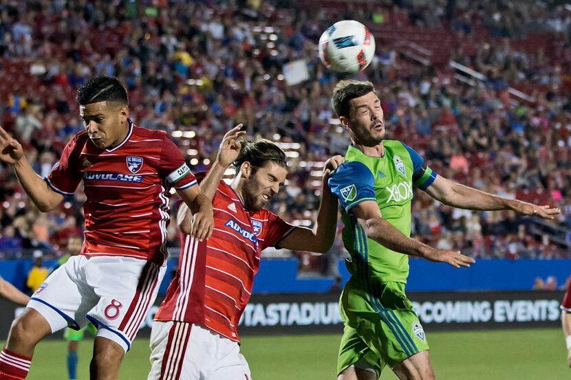 May 14, 2016; Dallas, TX, USA; Seattle Sounders FC forward Brad Evans (3) heads the ball as...
