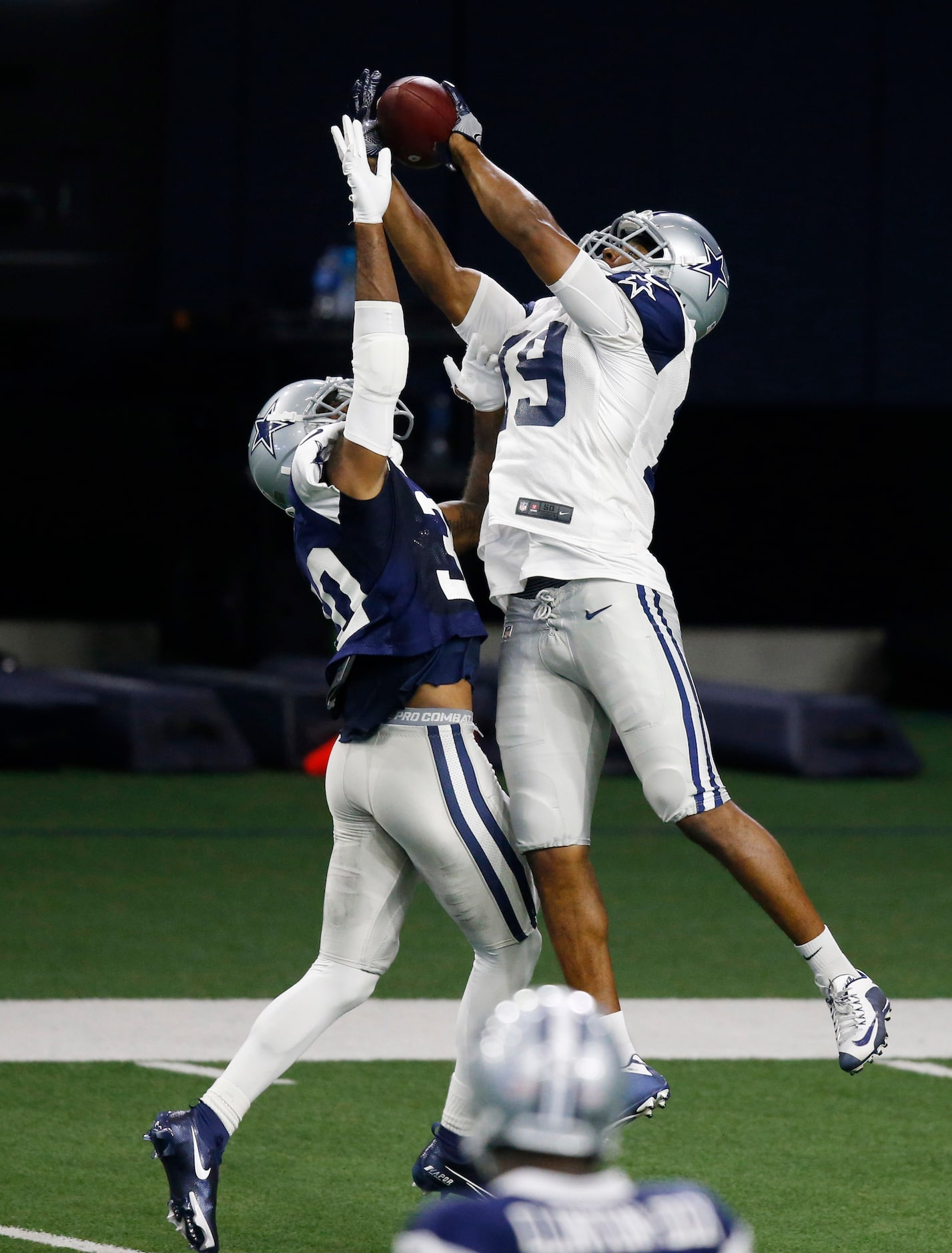 Dallas Cowboys wide receiver Amari Cooper (19) makes the catch over Dallas Cowboys...