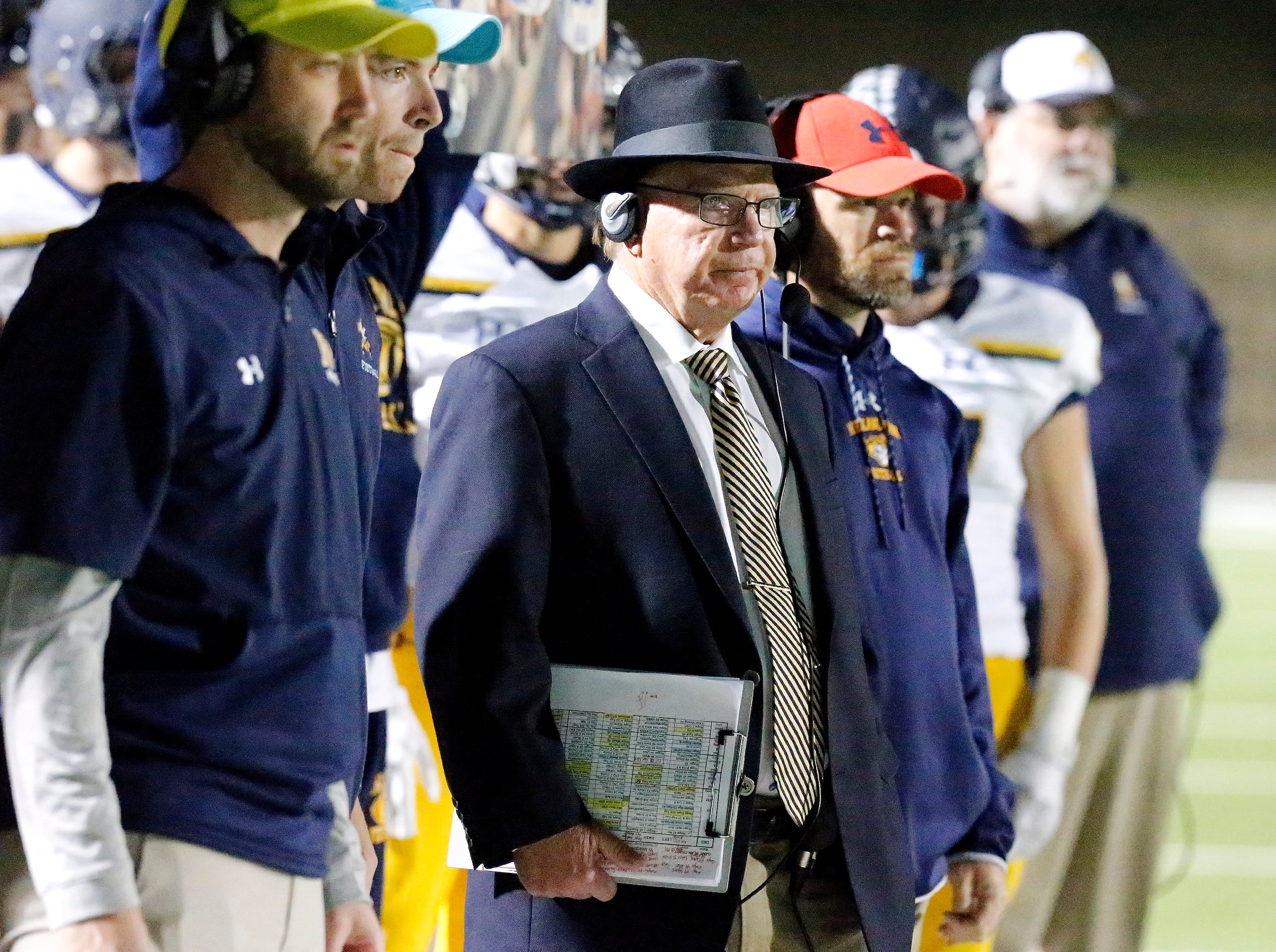 Highland Park High School head coach Randy Allen and his staff look on in a goal line...