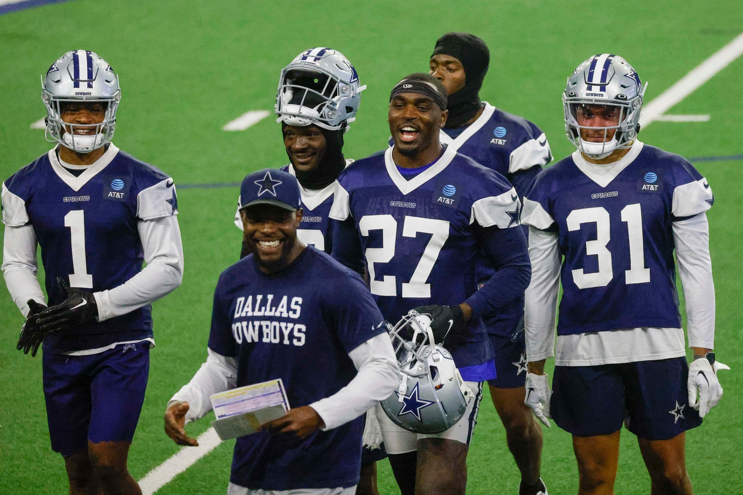 Dallas Cowboys safety Jayron Kearse (27) smiles as he leaves the field during timeout with...